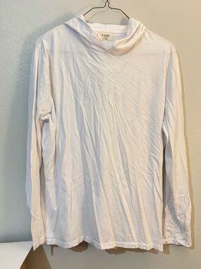 M. Singer white long-sleeve hooded t-shirt or lightweight hoodie.
